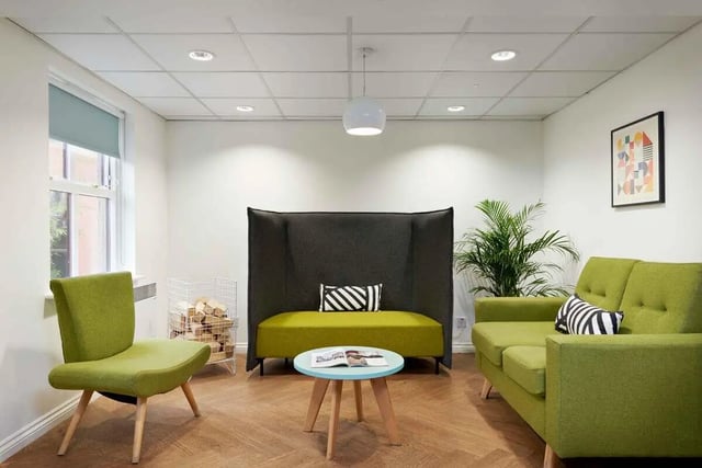 Green sofas high back seating and modern living room at Snow Island in Huddersfield Student Accommodation