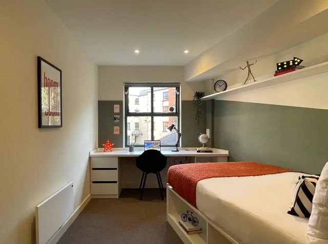 Bed desk laptop and picture bedroom at Snow Island in Huddersfield Student Accommodation