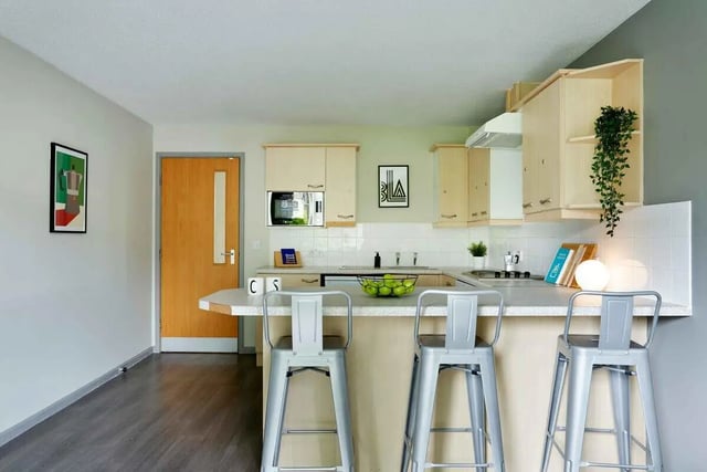 Kitchen island with stools and cabinets kitchen at Firth Point in Huddersfield Student Accommodation