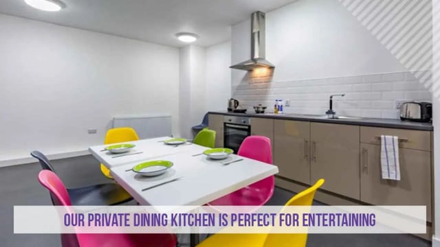 Dining table chairs and kitchen units kitchen at Kensington House in Birmingham Student Accommodation