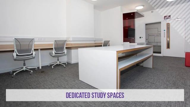 Two chairs long desk and bench study area at Kensington House in Birmingham Student Accommodation