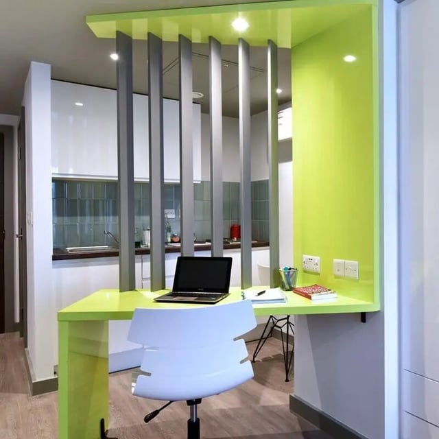 Desk chair laptop kitchen area study area at The Courtyard Block A in Huddersfield Student Accommodation