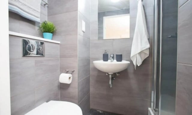 Toilet sink and shower stall bathroom at Edge Apartments - Leicester in Leicester Student Accommodation