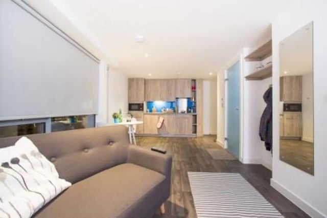 Sofa kitchen cabinets microwave mirror living room at Edge Apartments - Leicester in Leicester Student Accommodation