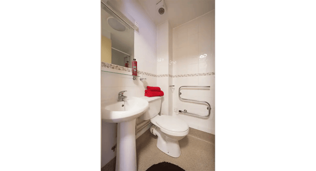 Sink toilet towel rack and mirror bathroom at Q3 Apartments in Manchester Student Accommodation
