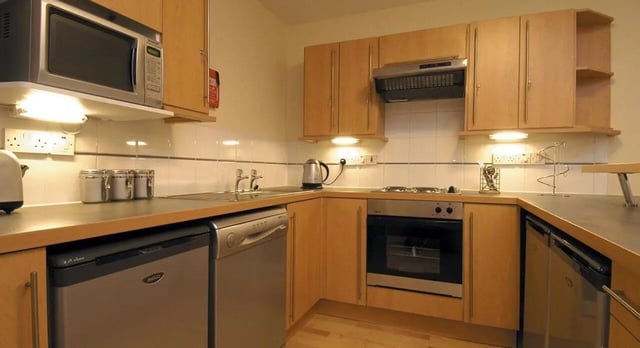 Microwave dishwasher oven and kettle kitchen at Q3 Apartments in Manchester Student Accommodation