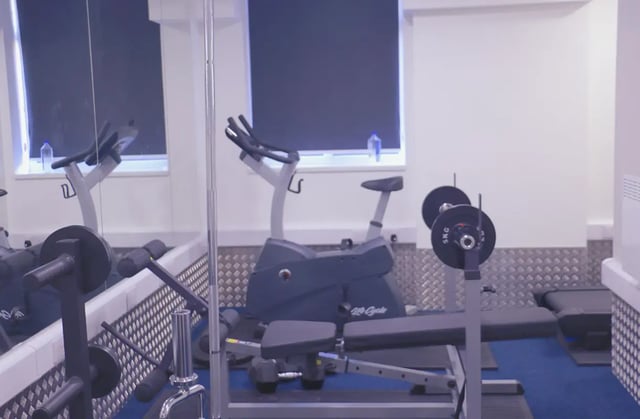 Exercise bikes and weight bench gym area at Renaissance House in Leicester Student Accommodation