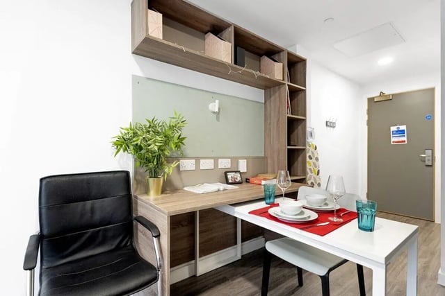Desk plant chair table and shelves study area at Stanhope House Portsmouth in Portsmouth Student Accommodation