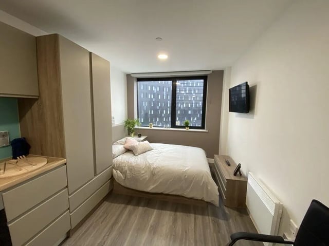 Bed wardrobe counter and window bedroom at Stanhope House Portsmouth in Portsmouth Student Accommodation