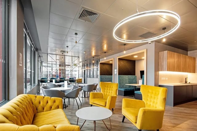 Yellow sofa chairs tables modern lounge at Coppergate Swansea in Swansea Student Accommodation