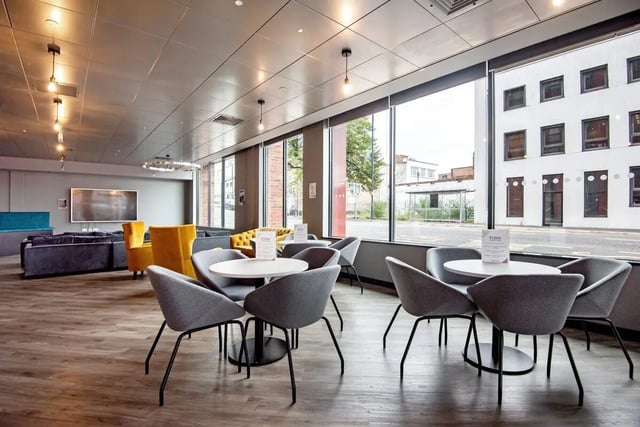 Gray chairs and tables communal lounge living room at Coppergate Swansea in Swansea Student Accommodation