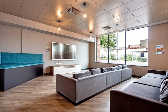 Sofas television and bench living room at Coppergate Swansea in Swansea Student Accommodation