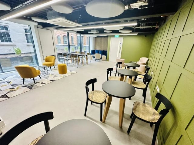 Tables chairs rug modern communal area at The Nest Leicester in Leicester Student Accommodation
