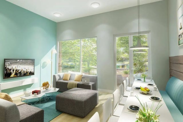Sofa TV dining table and chairs living area at Graystacks in Nottingham Student Accommodation