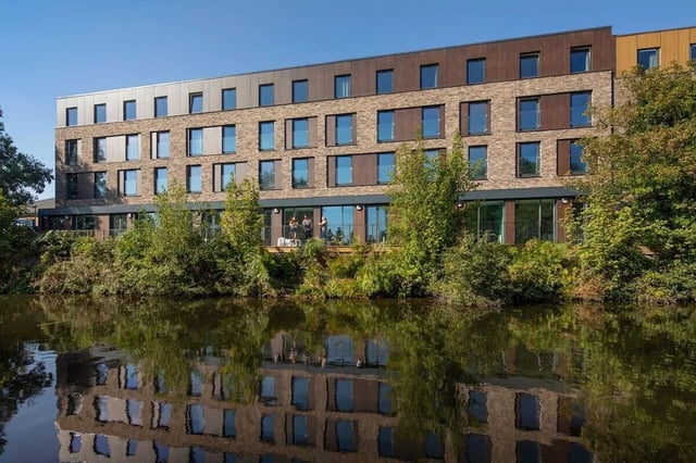 Modern building with balconies overlooking water exterior at Graystacks in Nottingham Student Accommodation