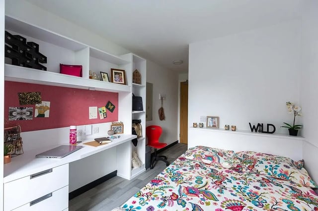 Desk with laptop shelving and patterned bed Bedroom at Abbey House in Coventry Student Accommodation