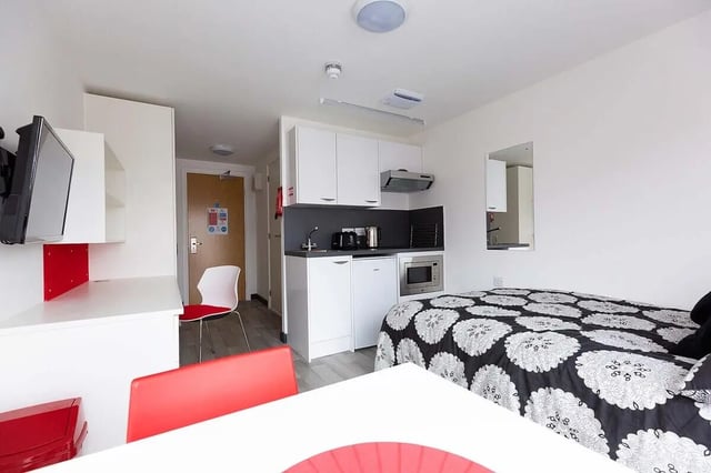 Bed kitchen area and desk study area at Julian Court in Coventry Student Accommodation