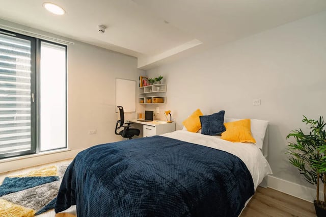 Bed desk chair whiteboard shelves bedroom at Hydrogen Falmouth in Falmouth Student Accommodation