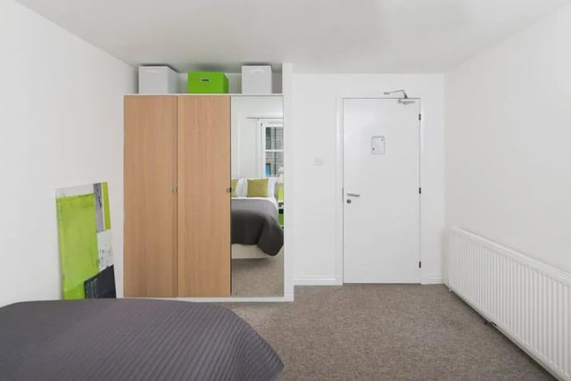 Wardrobe mirror reflection bed with pillows bedroom at Froghall in Aberdeen Student Accommodation