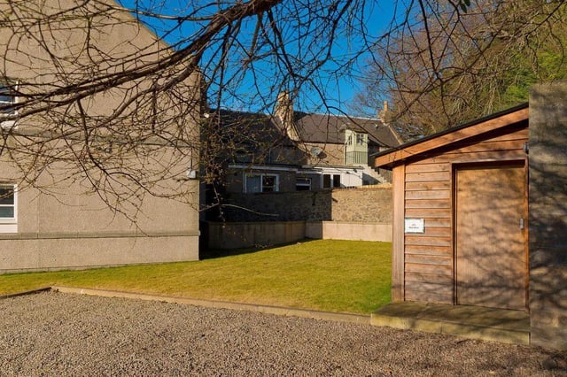 Wooden shed with bicycle sign exterior at Froghall in Aberdeen Student Accommodation