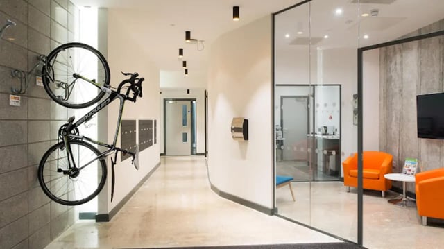 Bicycle on wall and modern seating area common area at CityBlock Penny Street in Lancaster Student Accommodation