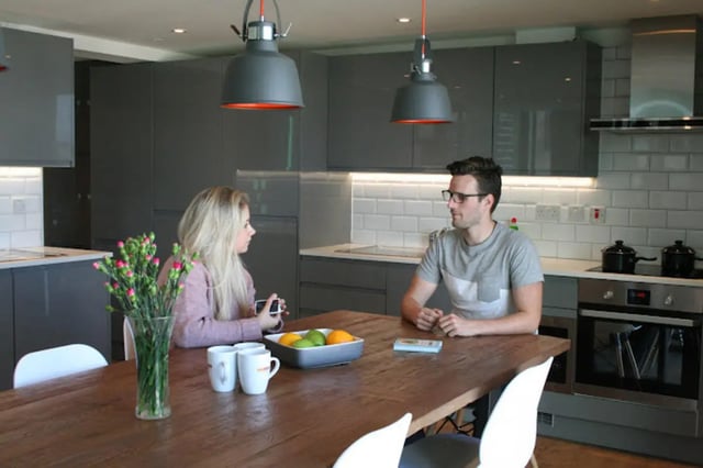 Couple at kitchen table with flowers kitchen at CityBlock Marton Street in Lancaster Student Accommodation