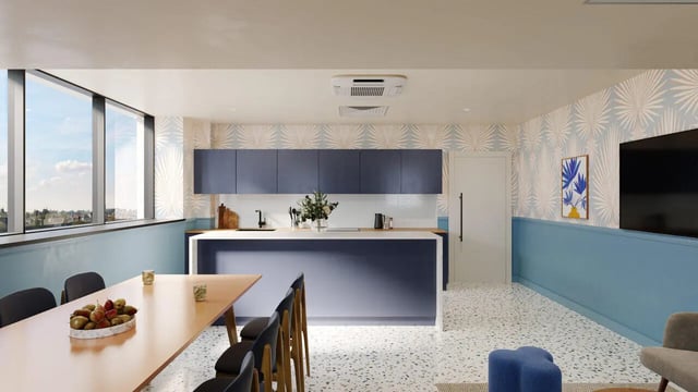 Modern kitchen island with bar stools dining table living room at B16 Studios in Birmingham Student Accommodation