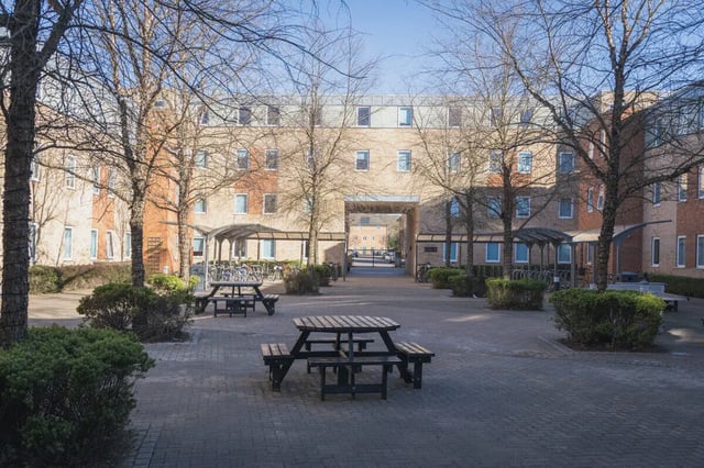 Picnic tables in accommodation courtyard exterior at The Park in Oxford Student Accommodation