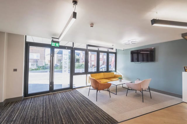 Sofa chairs table and television communal area at The Park in Oxford Student Accommodation