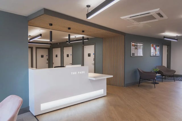 Reception desk doors chairs waiting area exterior at The Park in Oxford Student Accommodation