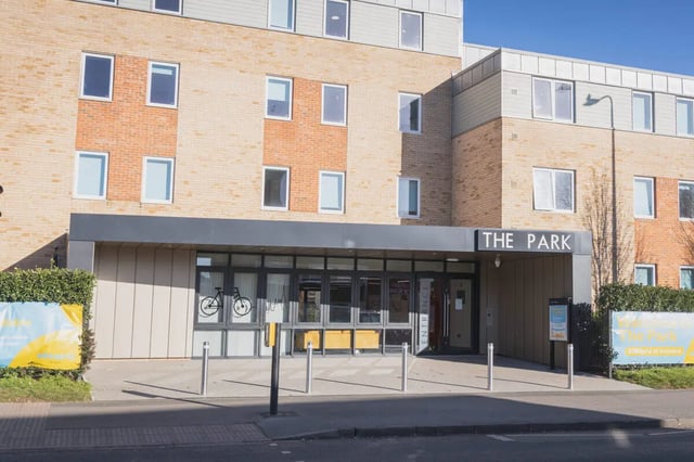 Brick building with large windows and "The Park" sign exterior at The Park in Oxford Student Accommodation