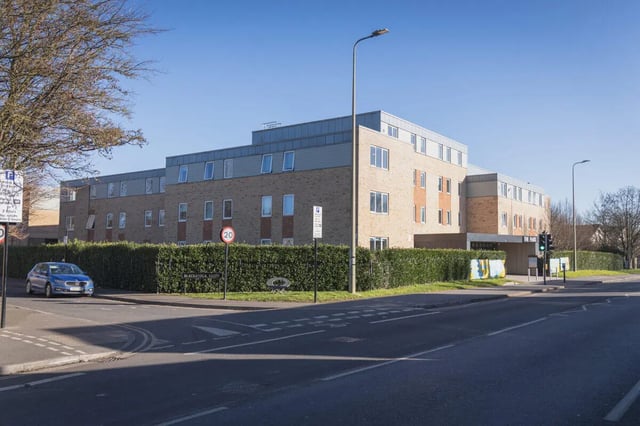 Modern brick building with hedges street parking exterior at The Park in Oxford Student Accommodation