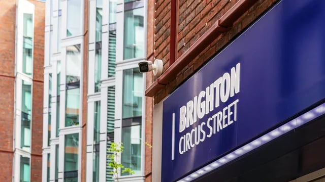 Security camera and Brighton Circus Street sign exterior at Kaplan Living Brighton in Brighton Student Accommodation