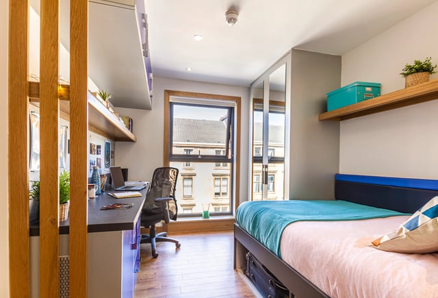 Bed desk chair window and shelves bedroom at Kaplan Living Glasgow - Argyle Street in Glasgow Student Accommodation