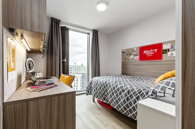 Desk laptop ring light bed and window bedroom at Kaplan Living Liverpool in Liverpool Student Accommodation