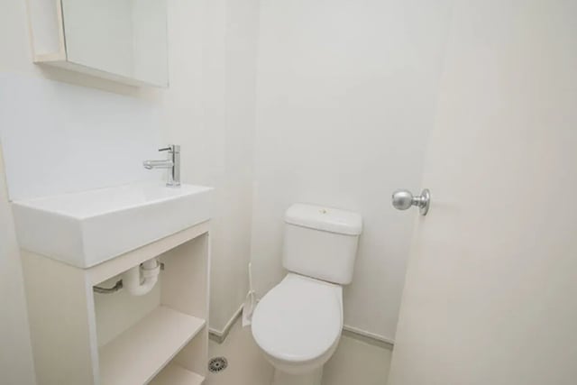 White toilet and sink with vanity bathroom at The Collective at Columbia Apartments in Columbia Student Accommodation