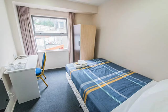 Bed desk chair wardrobe and window bedroom at The Collective at Columbia Apartments in Columbia Student Accommodation