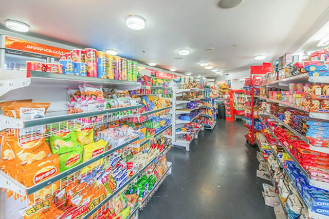 Snack-filled shelves lining store aisle convenience store at The Collective at Columbia Apartments in Columbia Student Accommodation