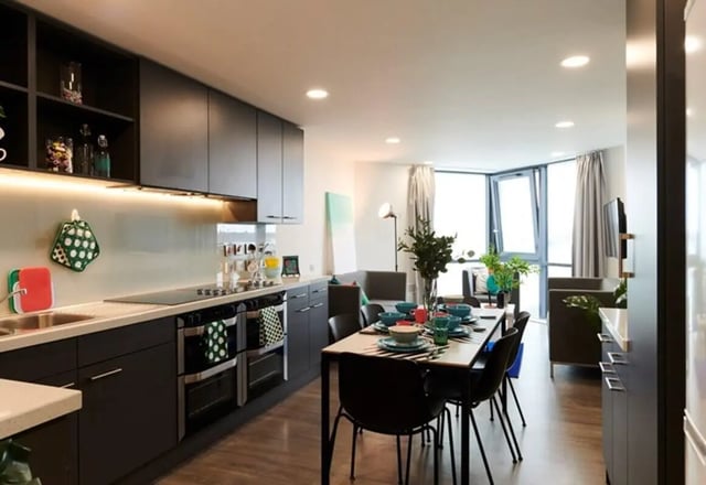 Modern kitchen with dining table and living area kitchen at Beckett House in Dublin Student Accommodation