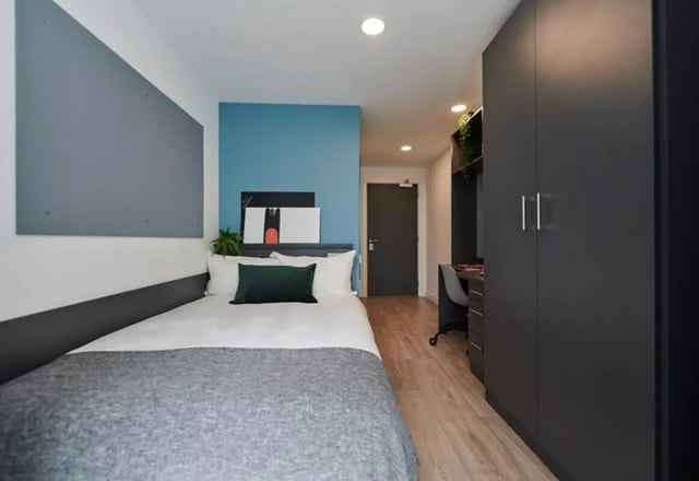 Bed wardrobe desk and artworks bedroom at Beckett House in Dublin Student Accommodation