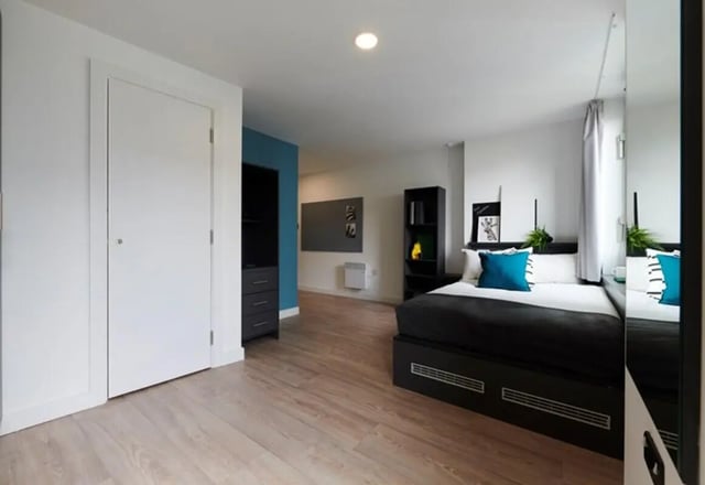 Closet bed bookshelf and whiteboard bedroom at Beckett House in Dublin Student Accommodation