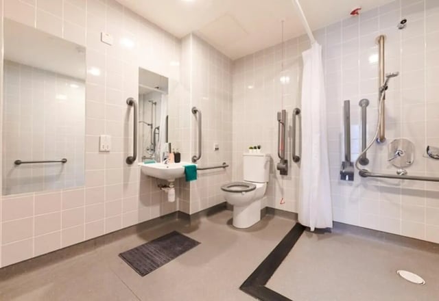 Accessible bathroom sink toilet shower grab bars bathroom at Dorset Point in Dublin Student Accommodation