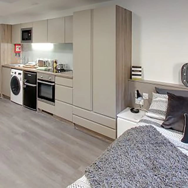 Bedside cabinet and kitchen appliances studio at Sycamore House in Leeds Student Accommodation