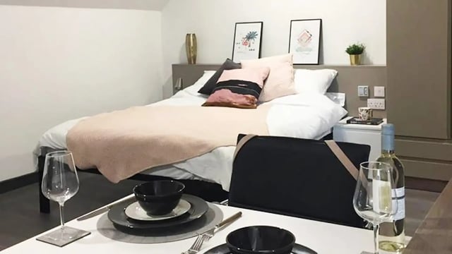 Bed table settings and wine bedroom at Sycamore House in Leeds Student Accommodation