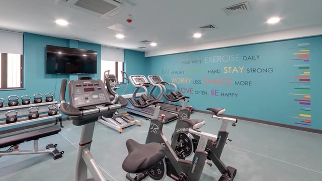 Treadmills bikes weights rack TV gym at Sycamore House in Leeds Student Accommodation