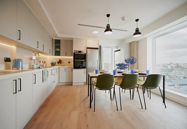 Modern kitchen with dining table and chairs kitchen at The Loom in Dublin Student Accommodation