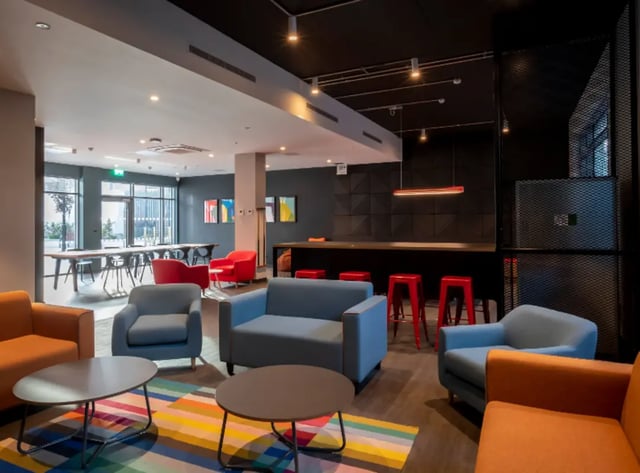 Sofas tables chairs stools communal area at Highlight Thomas Street in Dublin Student Accommodation