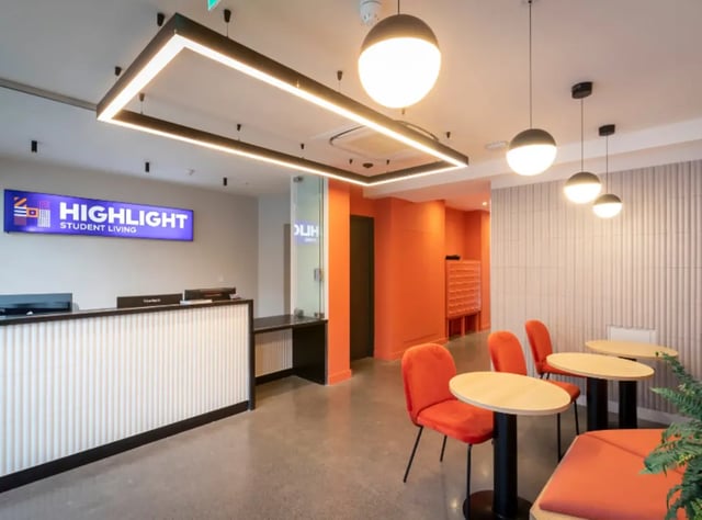 Reception desk tables chairs lounge area interior at Highlight Thomas Street in Dublin Student Accommodation