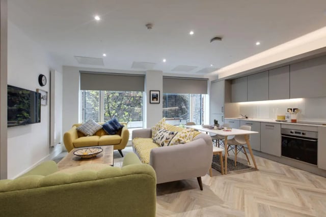 Sofa kitchen table and chairs living room kitchen at Cork Street Residence in Dublin Student Accommodation
