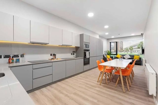 Modern kitchen with dining area and living room living room at Highfield House in Dublin Student Accommodation